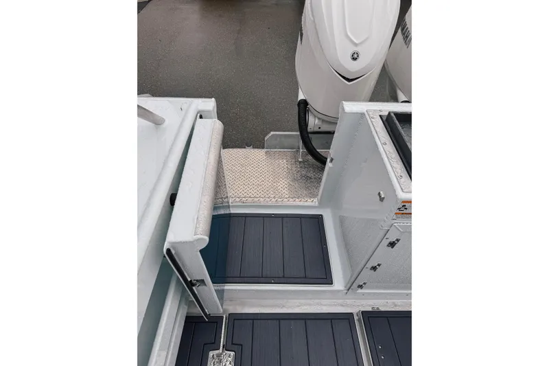 Slide: The Image of 2026 Hewescraft 290 Adventure boat deck with motor and storage compartments. - 18