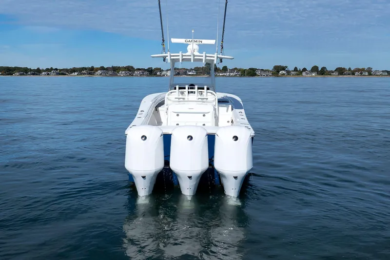 Slide: The Image of 2018 Regulator 34SS boat with triple engines on calm water. - 8