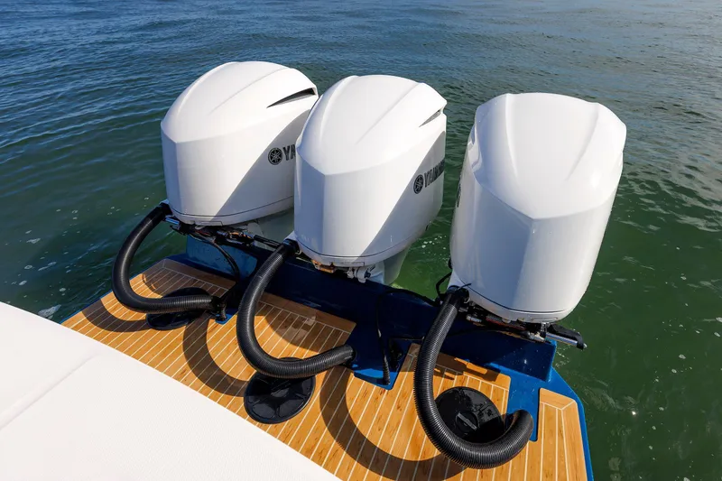 Slide: The Image of 2018 Regulator 34SS boat with triple Yamaha outboard engines on water. - 9