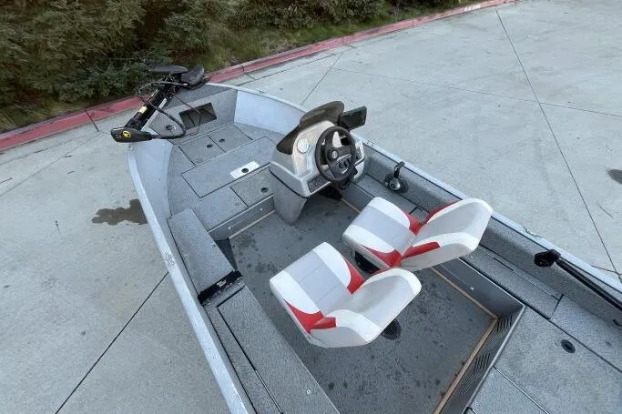 Slide: The Image of 2008 Tracker Super Guide V-14 SC boat with dual seats and steering console. - 19