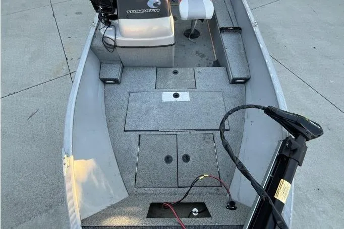 Slide: The Image of 2008 Tracker Super Guide V-14 SC boat interior with seating and storage compartments. - 5