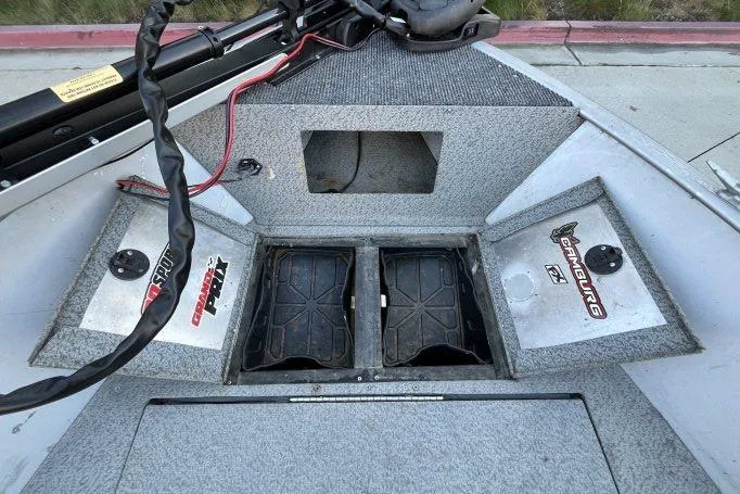 Slide: The Image of 2008 Tracker Super Guide V-14 SC boat interior with storage compartments open. - 6