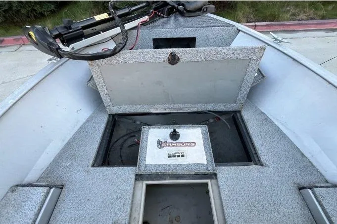 Slide: The Image of 2008 Tracker Super Guide V-14 SC boat interior with storage compartments open. - 7