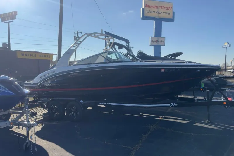 Slide: The Image of 2016 Chaparral 227 SSX boat on trailer at dealership, sunny day. - 3