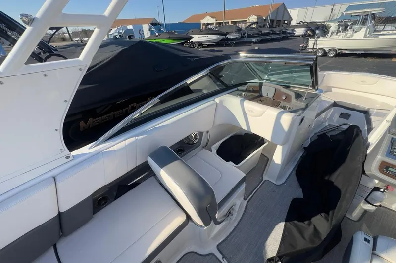 Slide: The Image of 2016 Chaparral 227 SSX boat interior with seating and dashboard view. - 9