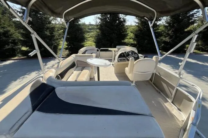 Slide: The Image of 2013 Godfry Sweetwater pontoon boat interior with seating and canopy. - 7