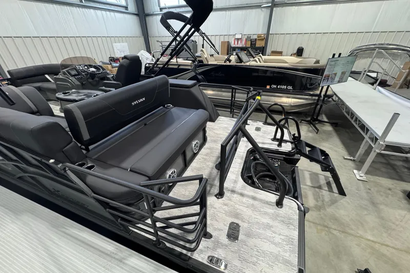 Slide: The Image of 2026 Sylvan Mirage X X3 CLZ pontoon boat interior with sleek seating and modern design. - 10