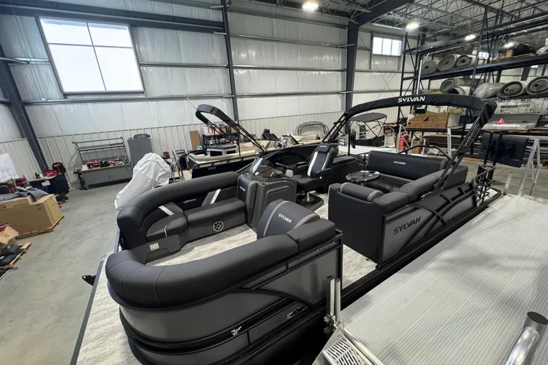Slide: The Image of 2026 Sylvan Mirage X X3 CLZ pontoon boat in a warehouse setting. - 4