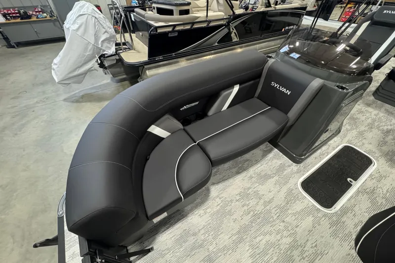 Slide: The Image of 2026 Sylvan Mirage X X3 CLZ boat interior with sleek black seating and modern design. - 5