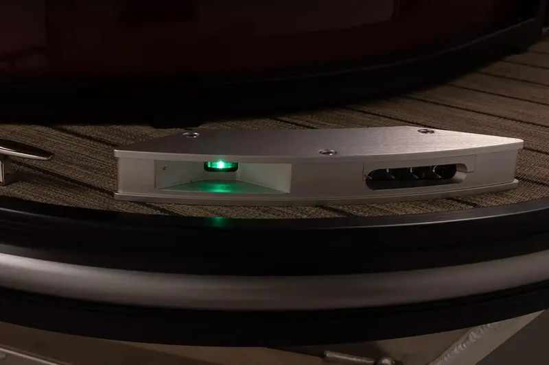 Slide: The Image of 2026 SunCatcher Fusion 322SS boat detail with illuminated green light on deck. - 10