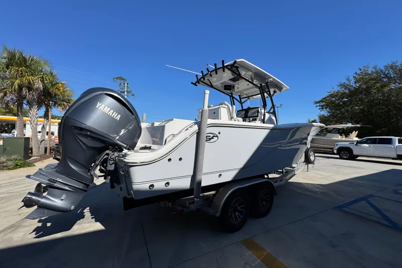 Slide: The Image of 2022 Sea Fox 288 Commander boat with Yamaha engine on trailer, parked outdoors. - 11