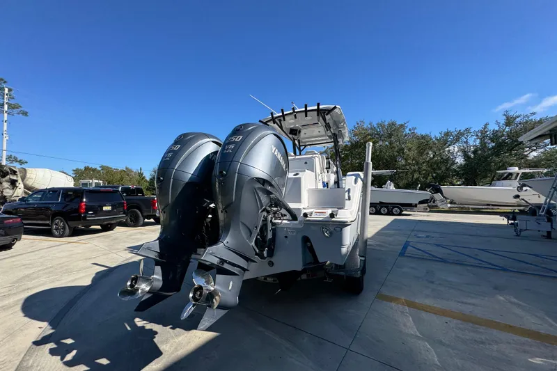 Slide: The Image of 2022 Sea Fox 288 Commander with dual Yamaha outboard engines in a marina setting. - 12