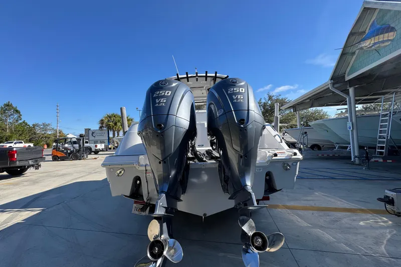 Slide: The Image of 2022 Sea Fox 288 Commander with dual 250 V6 outboard engines in a marina setting. - 13