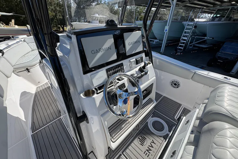 Slide: The Image of 2022 Sea Fox 288 Commander boat cockpit with Garmin displays and Yamaha controls. - 32