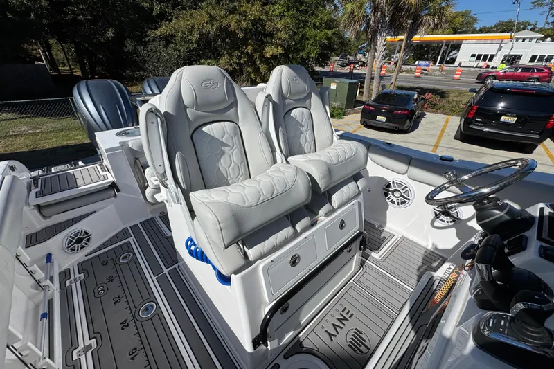 Slide: The Image of 2022 Sea Fox 288 Commander boat interior with dual captain's chairs and modern dashboard. - 36