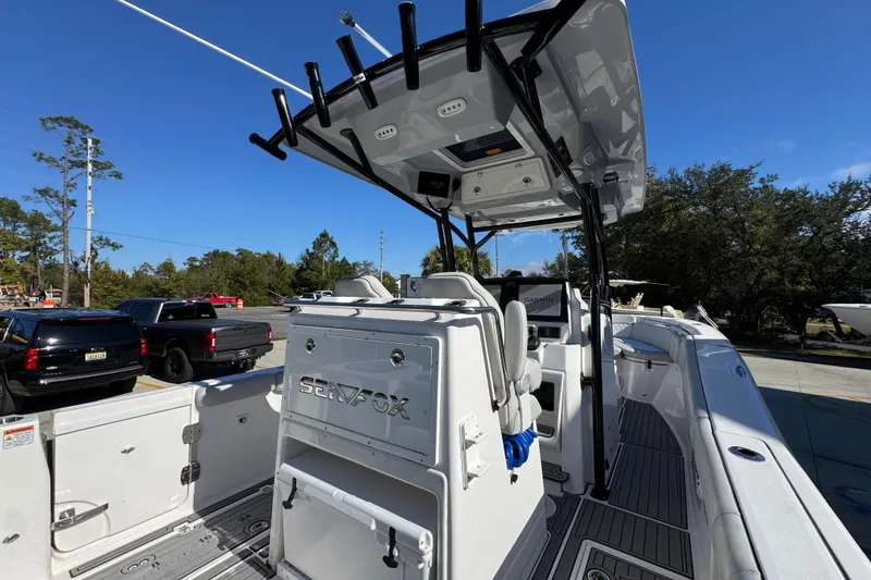 Slide: The Image of 2022 Sea Fox 288 Commander boat with sleek design and modern features, parked outdoors. - 39