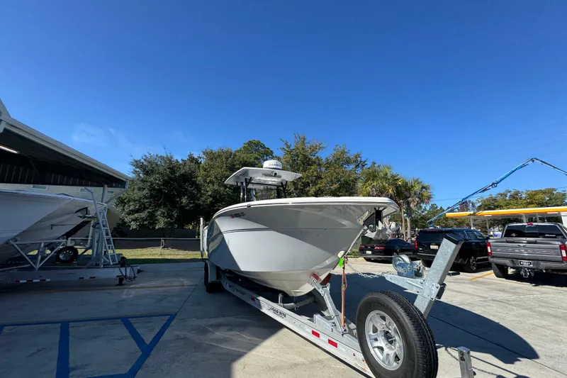 Slide: The Image of 2022 Sea Fox 288 Commander boat on trailer under clear blue sky. - 7