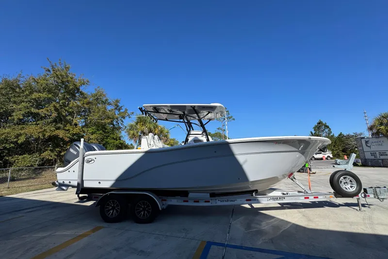 Slide: The Image of 2022 Sea Fox 288 Commander boat on trailer under clear blue sky. - 9