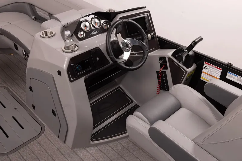 Slide: The Image of 2026 SunCatcher Fusion 322SS boat cockpit with modern steering and controls. - 9