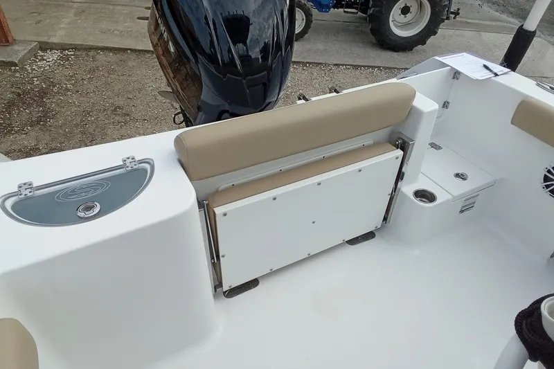 Slide: The Image of 2018 Sportsman Open 232 Center Console boat interior with foldable seat and storage. - 11