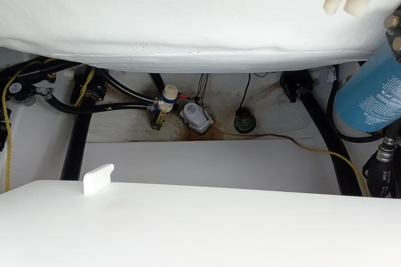 Slide: The Image of 2018 Sportsman Open 232 Center Console bilge area with hoses and components. - 12