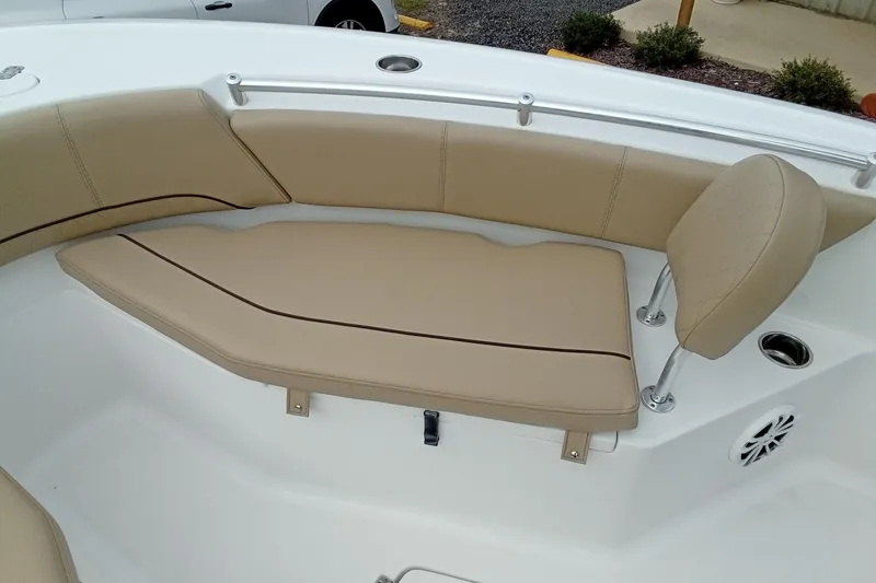 Slide: The Image of 2018 Sportsman Open 232 Center Console boat with tan cushioned seating. - 22
