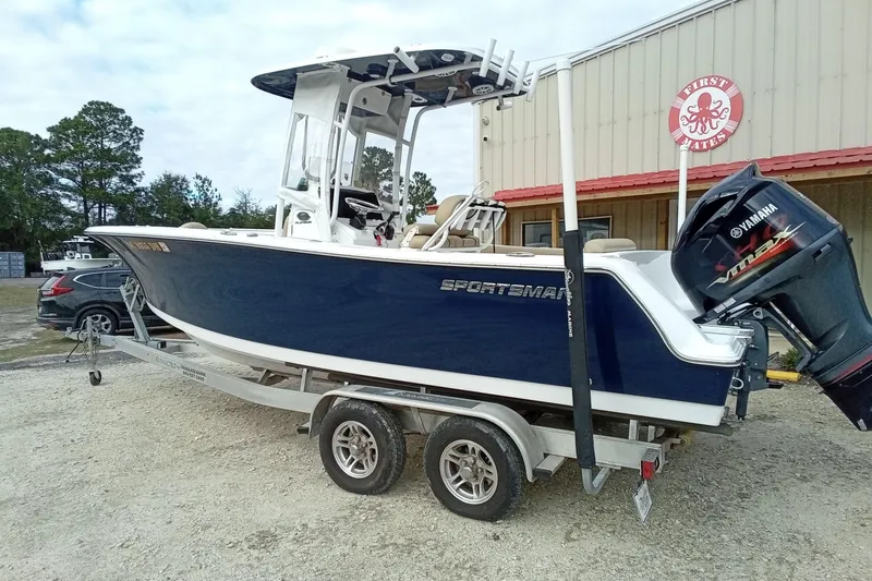 Slide: The Image of 2018 Sportsman Open 232 Center Console boat on trailer with Yamaha outboard motor. - 4