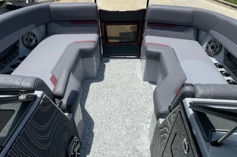 Slide: The Image of Luxurious interior of 2025 Revel RS25L boat with plush seating and modern design. - 10