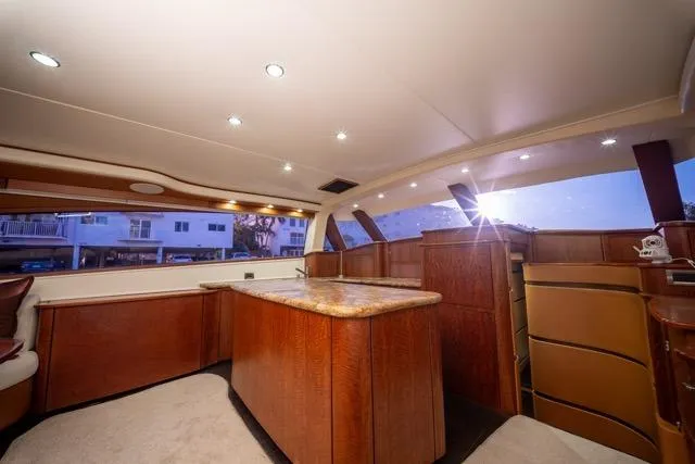 Slide: The Image of Luxurious interior of a 1997 Garlington Convertible yacht with elegant wood finishes. - 10