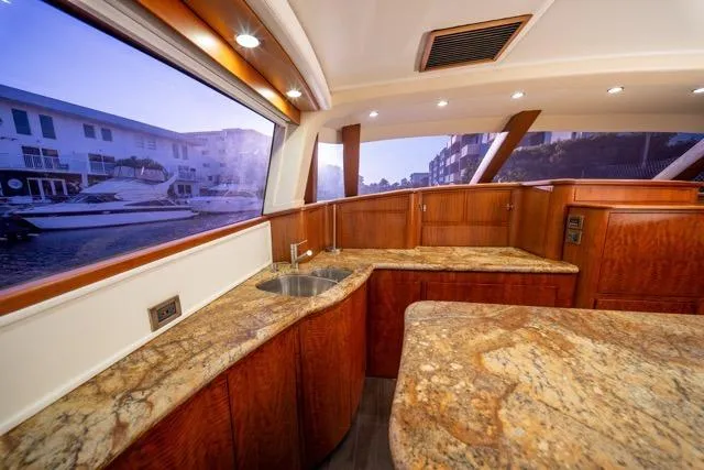 Slide: The Image of Luxurious 1997 Garlington Convertible yacht interior with elegant wood and granite finishes. - 11