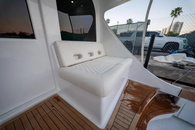 Slide: The Image of Luxurious seating on 1997 Garlington Convertible yacht with wooden deck and modern design. - 13