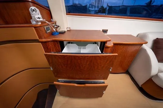 Slide: The Image of 1997 Garlington Convertible interior with open wooden cabinets and modern equipment. - 16