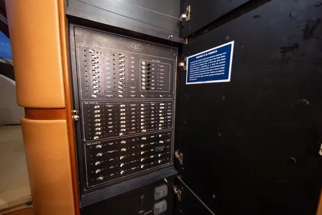 Slide: The Image of Electrical panel inside a 1997 Garlington Convertible, showcasing switches and controls. - 19