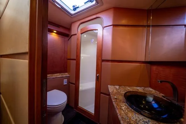 Slide: The Image of Luxurious bathroom interior of a 1997 Garlington Convertible yacht with modern fixtures. - 2