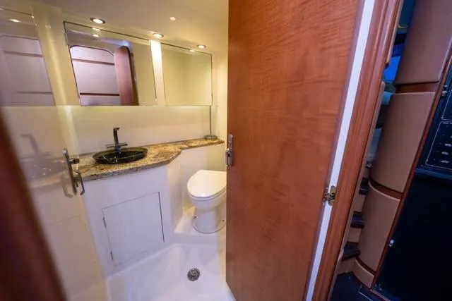 Slide: The Image of Luxurious bathroom in 1997 Garlington Convertible yacht with granite countertop and modern fixtures. - 20
