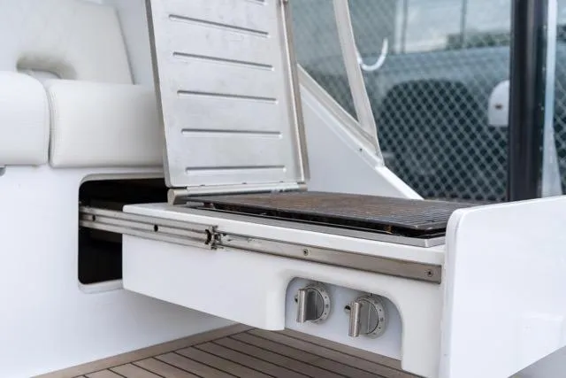 Slide: The Image of 1997 Garlington Convertible boat with built-in grill and seating area. - 22