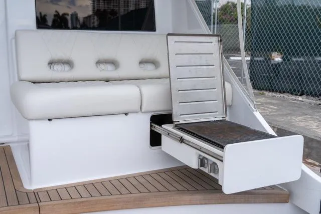 Slide: The Image of 1997 Garlington Convertible yacht with built-in grill and cushioned seating. - 23