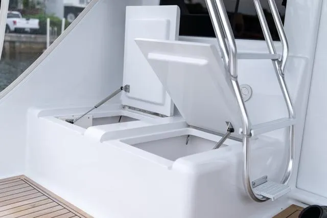 Slide: The Image of 1997 Garlington Convertible boat with open storage compartments and stainless steel ladder. - 25