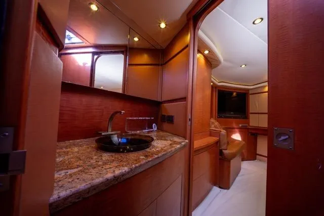 Slide: The Image of Luxurious 1997 Garlington Convertible yacht interior with elegant wood finishes and modern amenities. - 3