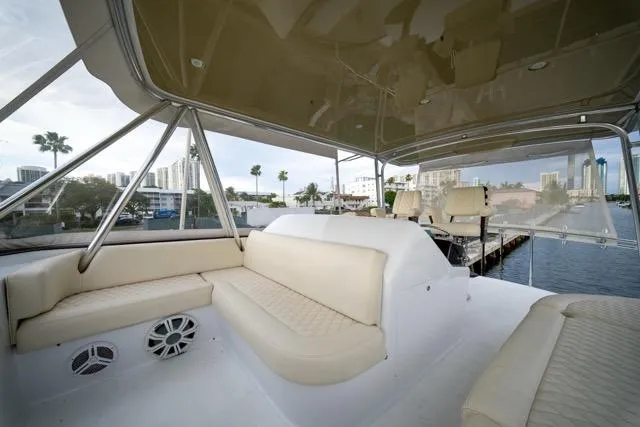 Slide: The Image of 1997 Garlington Convertible yacht interior with beige seating and waterfront view. - 31