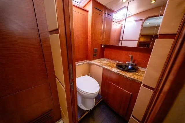 Slide: The Image of Luxurious bathroom in 1997 Garlington Convertible yacht with wood accents and granite countertop. - 38
