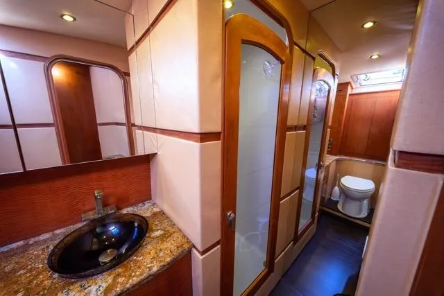 Slide: The Image of Luxurious bathroom interior of a 1997 Garlington Convertible yacht with modern fixtures. - 39