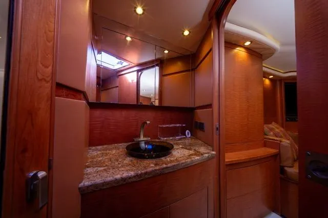 Slide: The Image of Luxurious 1997 Garlington Convertible yacht interior with elegant wood finish and granite countertop. - 4
