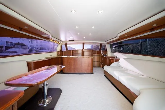 Slide: The Image of Luxurious interior of a 1997 Garlington Convertible yacht with elegant seating and wooden finishes. - 40