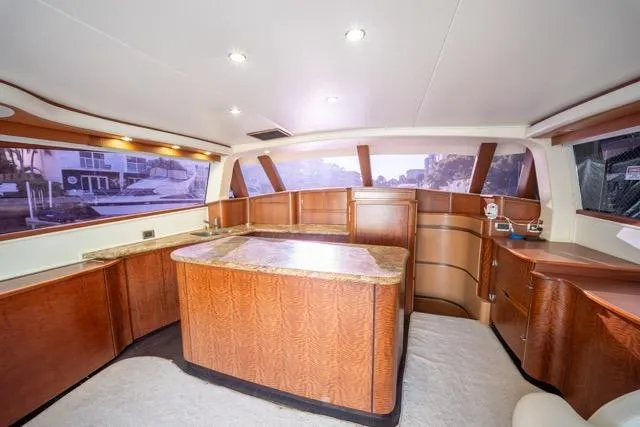 Slide: The Image of Luxurious interior of a 1997 Garlington Convertible yacht with elegant wood finishes. - 41