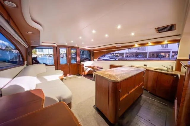Slide: The Image of Luxurious interior of a 1997 Garlington Convertible yacht with elegant wood finishes. - 43