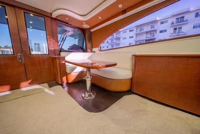 Slide: The Image of Interior of a 1997 Garlington Convertible yacht with elegant wood finish and seating area. - 44