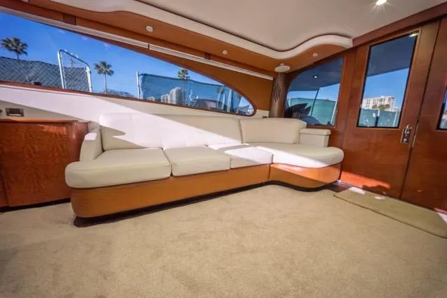 Slide: The Image of Luxurious interior of a 1997 Garlington Convertible yacht with plush seating and elegant wood finishes. - 45
