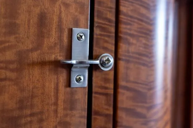 Slide: The Image of Close-up of a metal latch on a wooden surface, Garlington Convertible 1997. - 51
