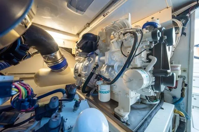 Slide: The Image of Engine room of a 1997 Garlington Convertible, showcasing detailed mechanical components. - 57
